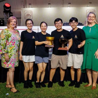 Members of the Meeting Place team posing with their Regional Best Laksa and Regional People's Choice Best Laksa awards, with Minister Cahill and Minister Boothby