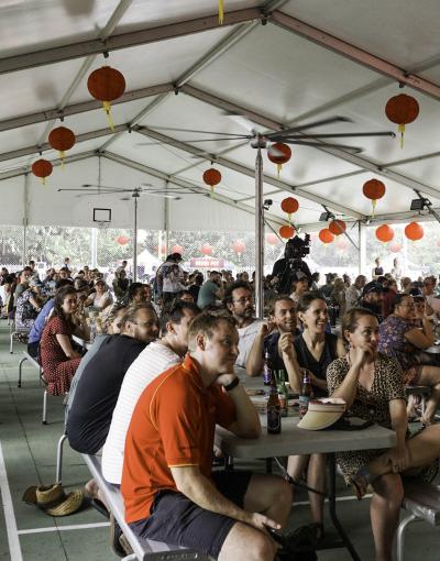 Crowd of people seated and enjoying Festival activities