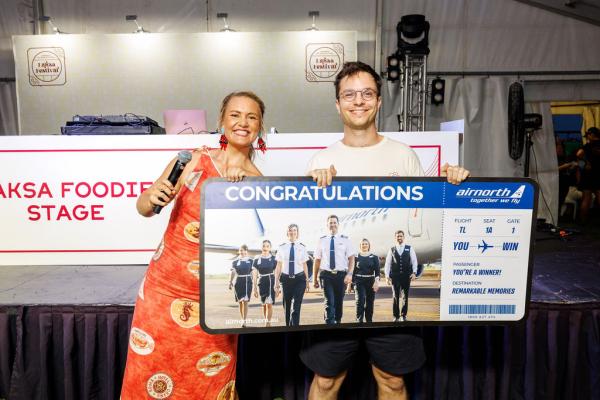 The Laksa League winner posing with their giant Air North boarding pass